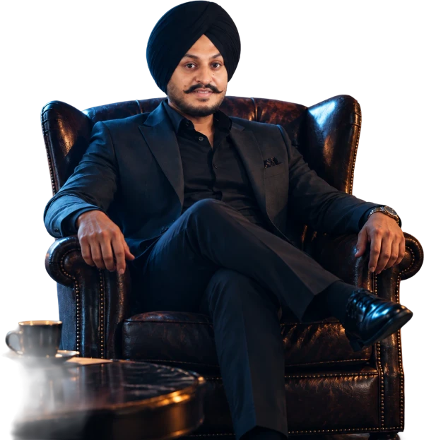 Nirwair Singh, Founder and CEO of Indi IT Solutions, seated in a leather armchair
