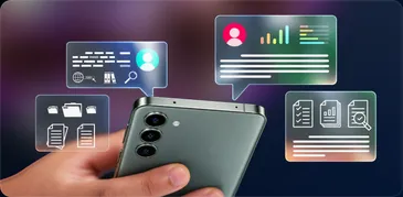 A hand holding an Android phone surrounded by business dashboards