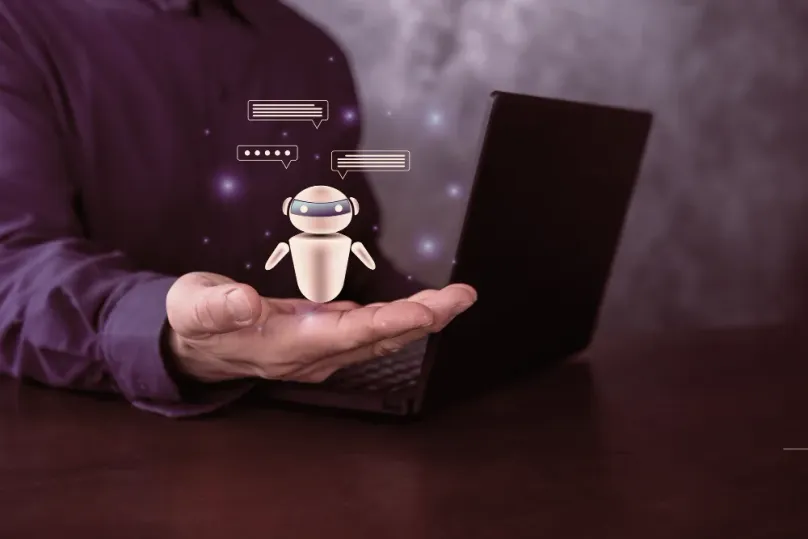 Chatbot robot hovering over an open palm