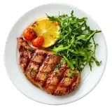 Grilled steak with arugula