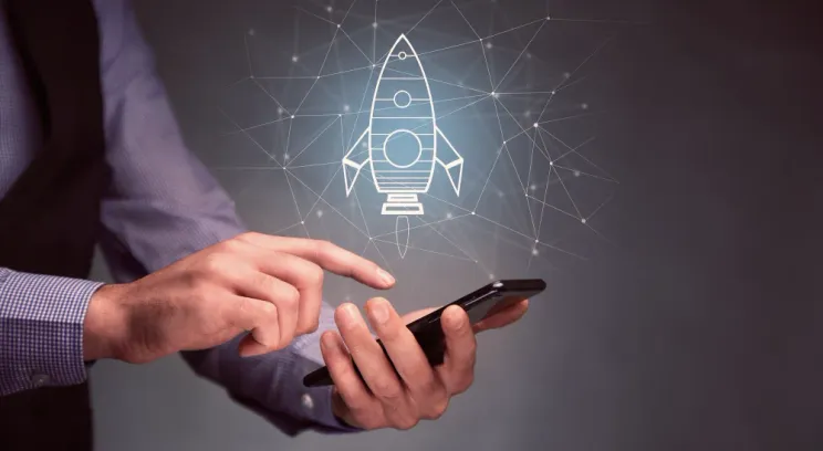 Rocket launch illustration over a phone