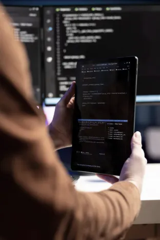 Developer reviewing secure code on a tablet